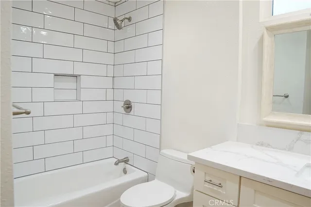 a bathroom with a bathtub and sink