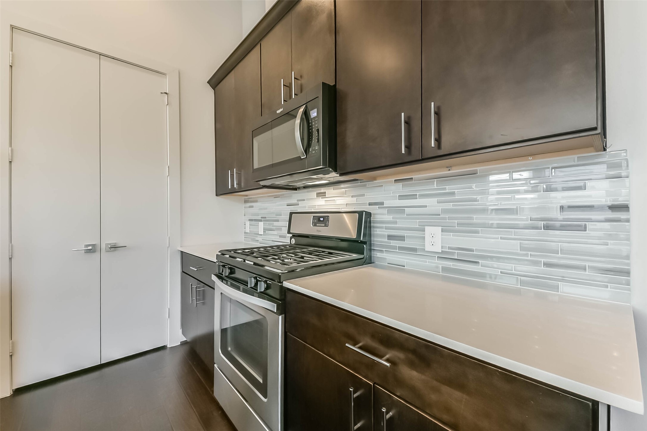 3206 North MacGregor Way, Unit A Houston, TX 77004 - Photo 20 of 30 a kitchen with a stove microwave and sink