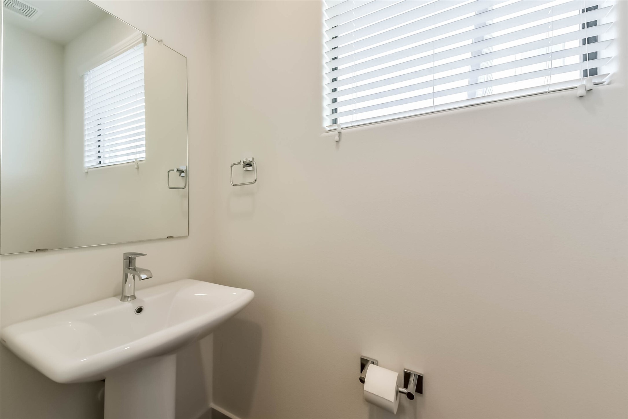 3206 North MacGregor Way, Unit A Houston, TX 77004 - Photo 26 of 30 a bathroom with a sink and a window