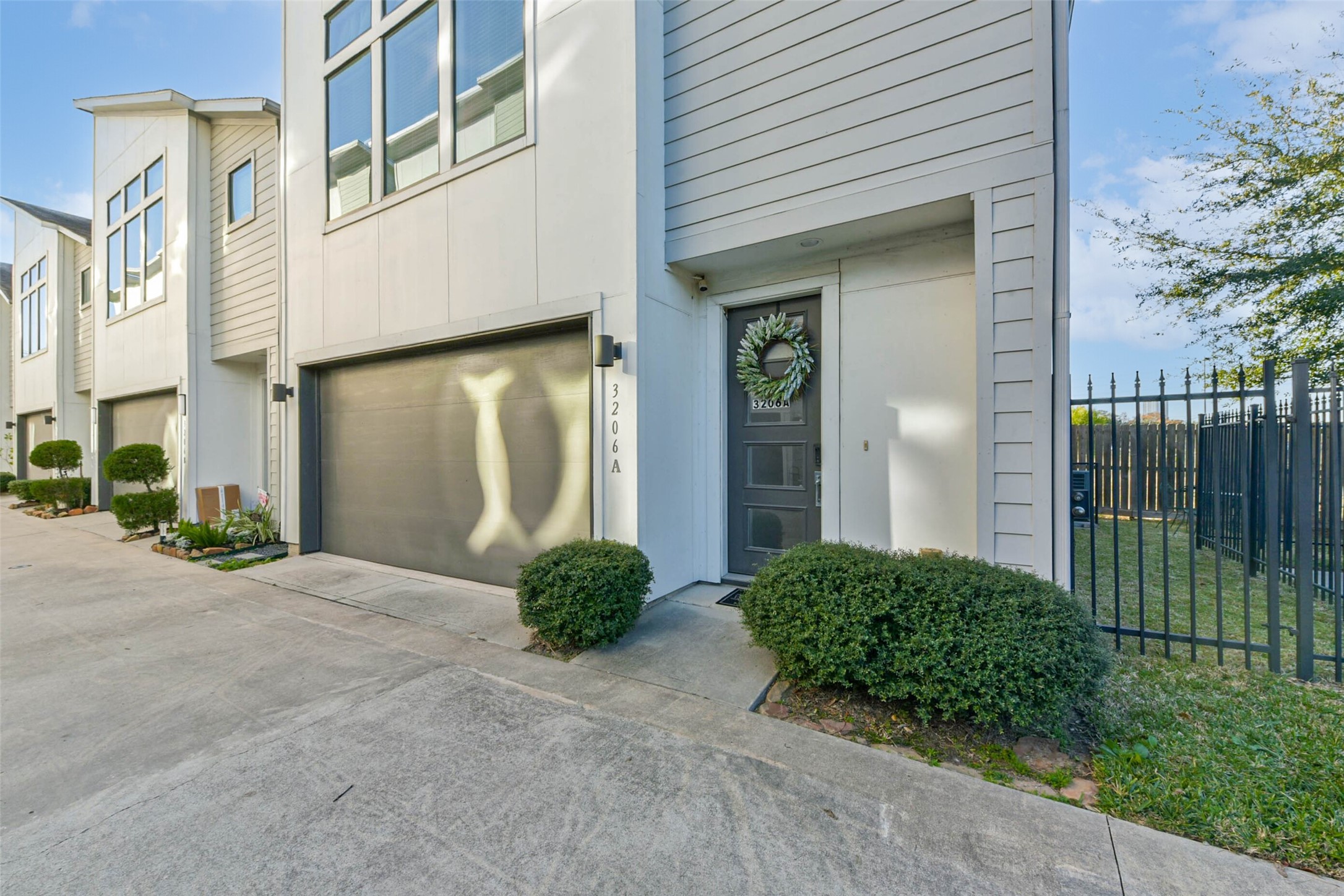 3206 North MacGregor Way, Unit A Houston, TX 77004 - Photo 3 of 30 a view of a house with backyard and glass windows