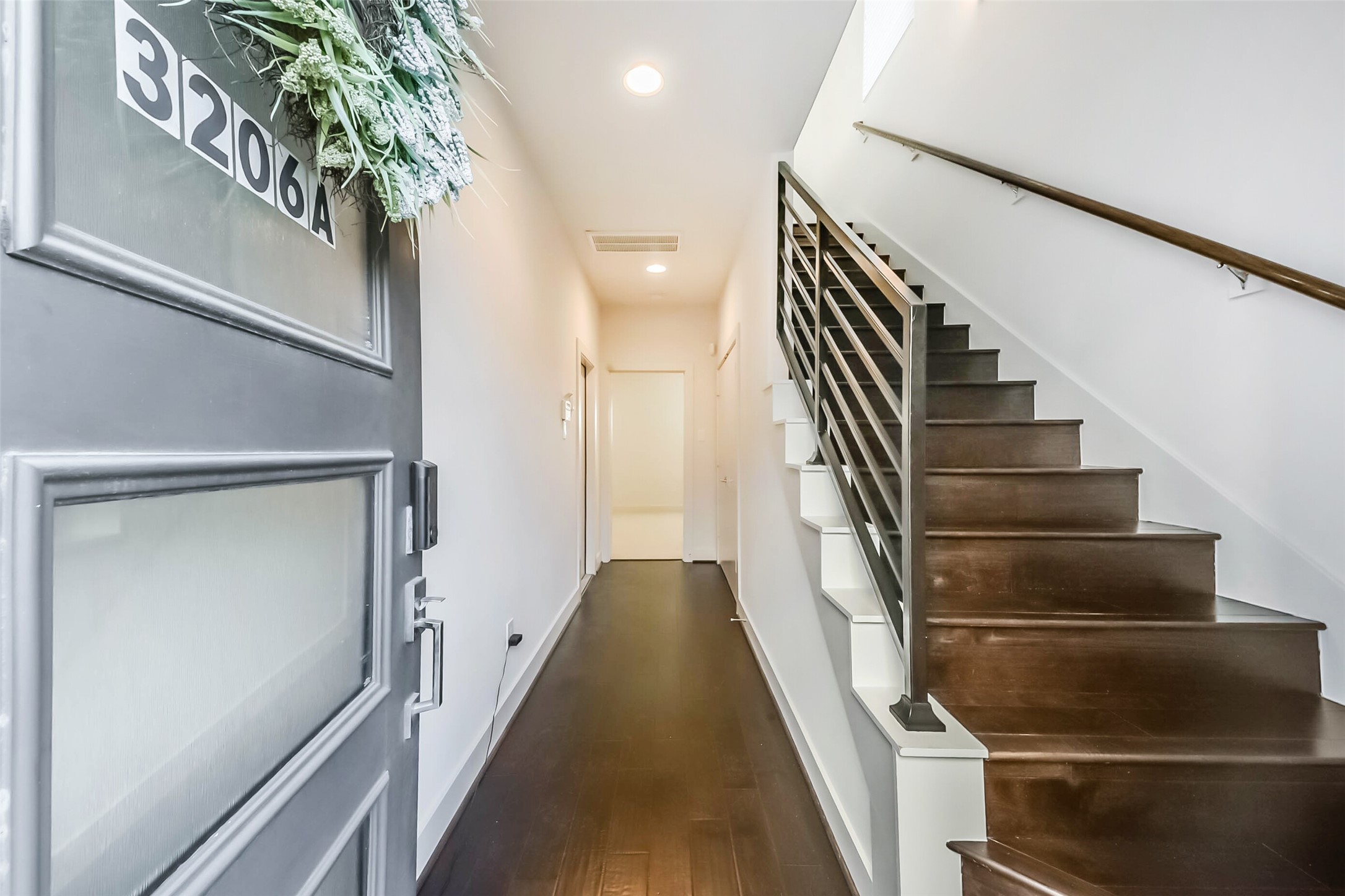 3206 North MacGregor Way, Unit A Houston, TX 77004 - Photo 5 of 30 a view of entryway and hall with wooden floor