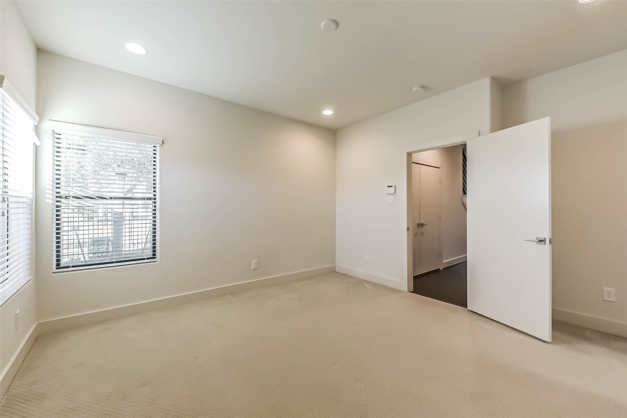 3206 North MacGregor Way, Unit A Houston, TX 77004 - Photo 6 of 30 an empty room with windows and closet