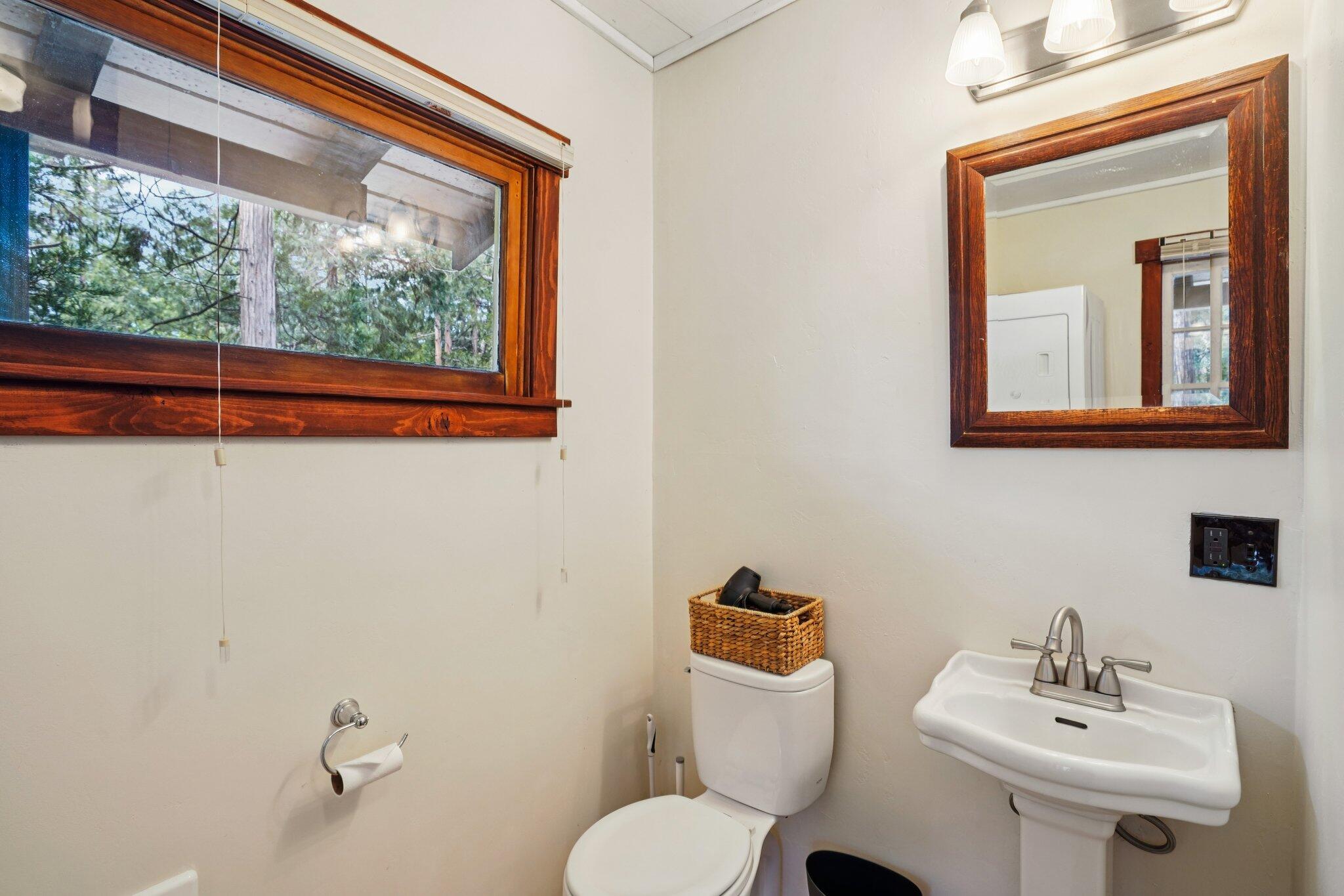 55280 Circle Way Idyllwild, CA 92549 - Photo 25 of 27 a bathroom with a toilet sink and mirror