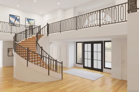 a view of staircase with railing and windows