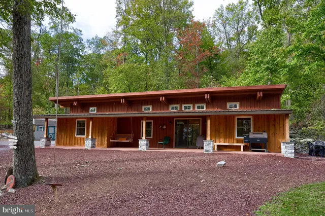 a view of a kitchen with a table and chairs