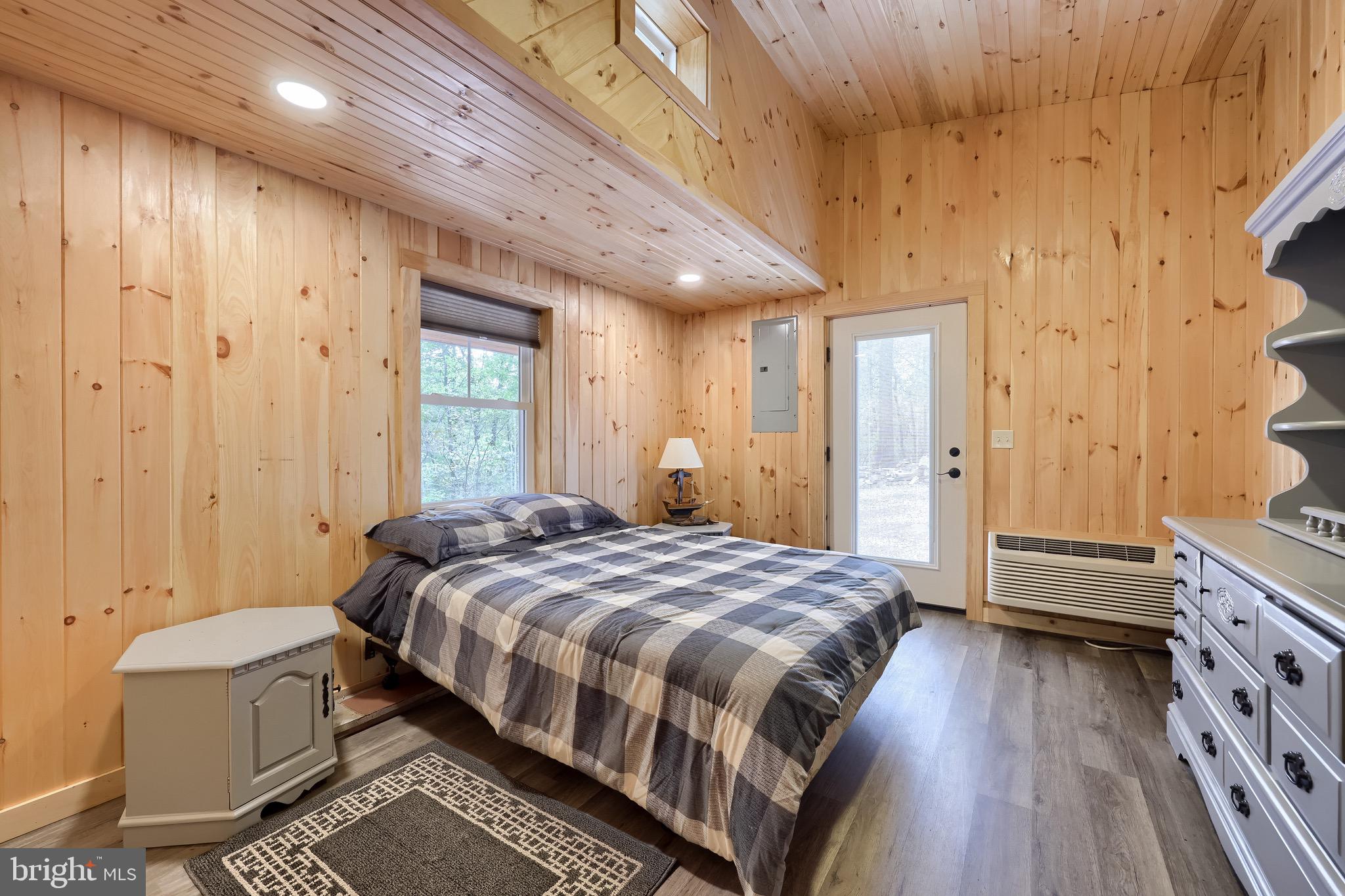 485 Airport Road Bethel, PA 19507 - Photo 27 of 71 a spacious bedroom with a bed and wooden floor