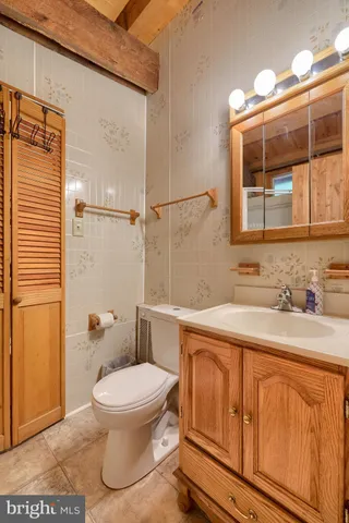 a view of a house with large trees