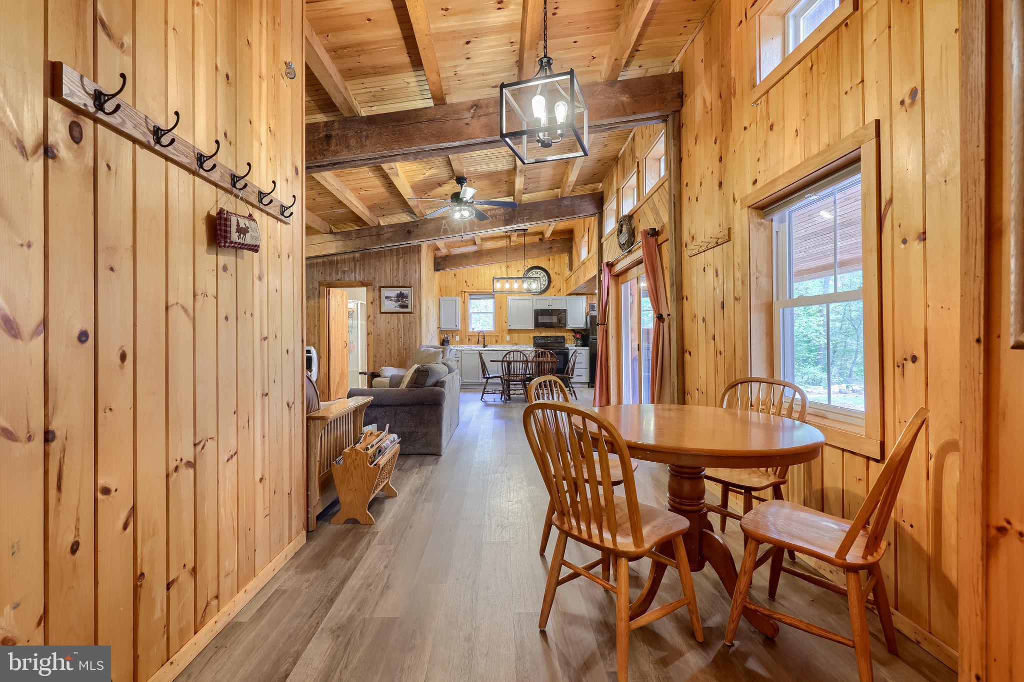 485 Airport Road Bethel, PA 19507 - Photo 36 of 71 a dining room with furniture and a chandelier