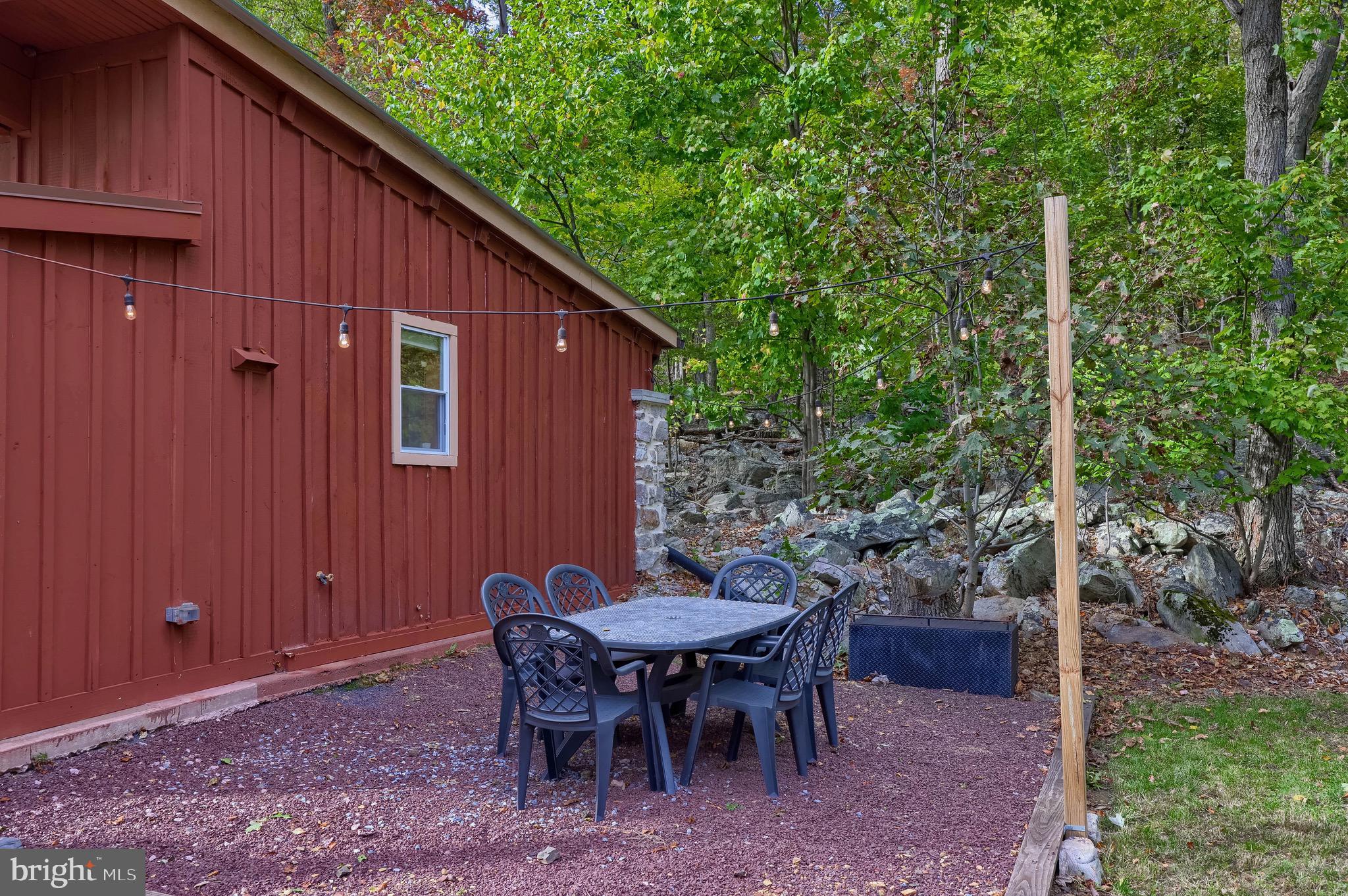 485 Airport Road Bethel, PA 19507 - Photo 39 of 71 a backyard of a house with a table and chairs
