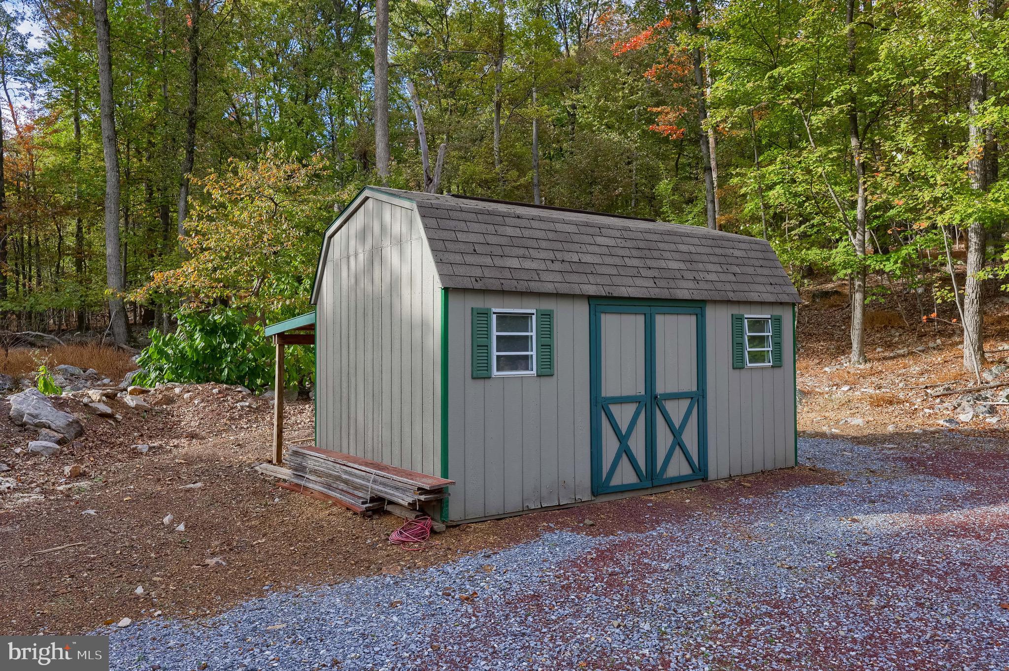 485 Airport Road Bethel, PA 19507 - Photo 43 of 71 a view of a house with a yard and large tree