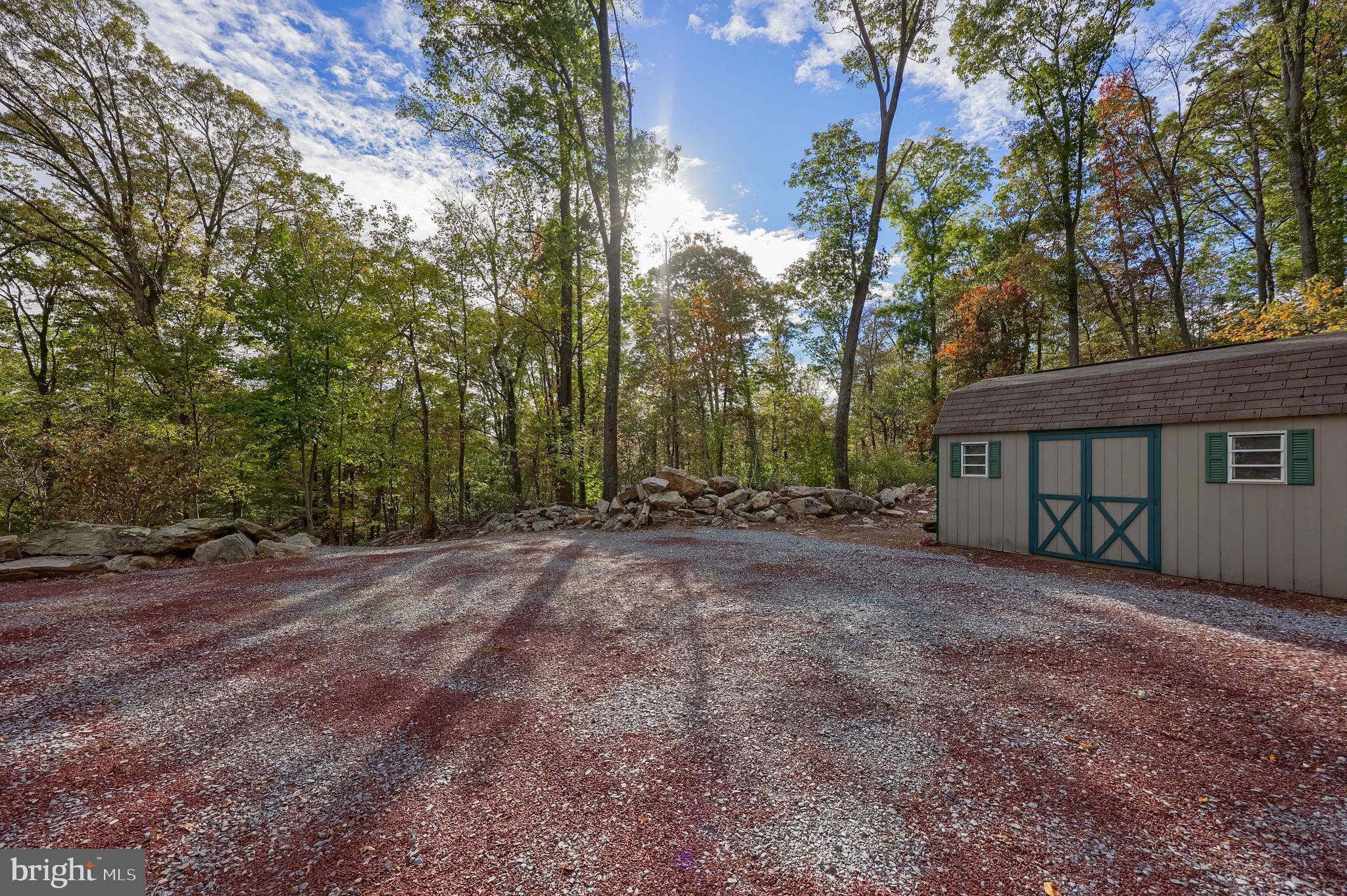 485 Airport Road Bethel, PA 19507 - Photo 46 of 71 a view of a house with large trees