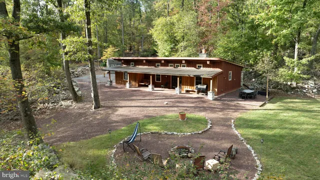 a view of a house with a tree