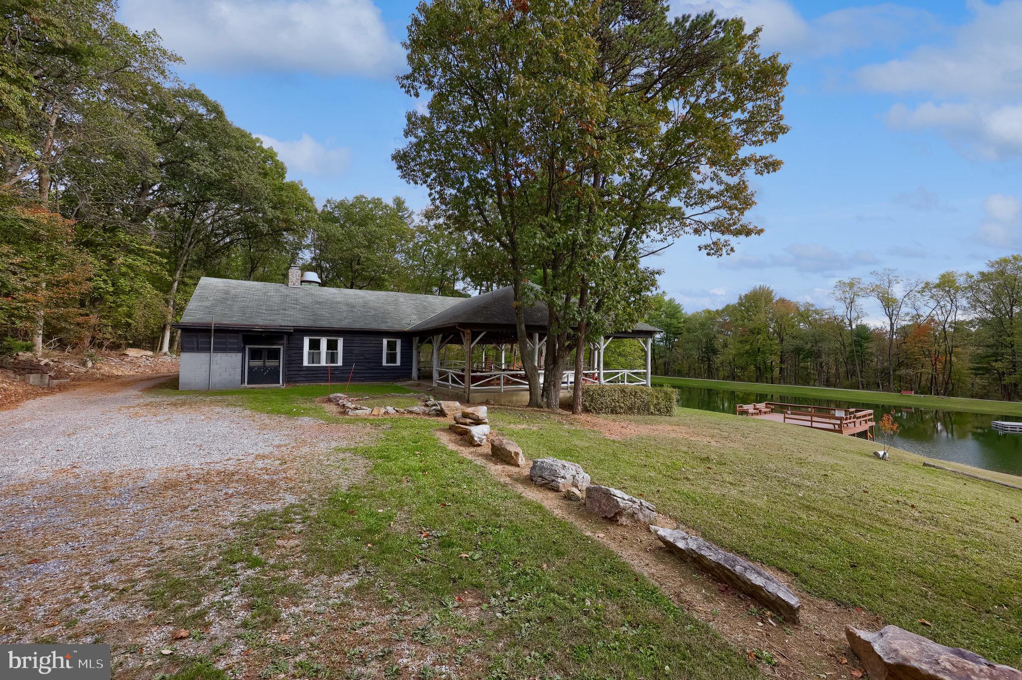 485 Airport Road Bethel, PA 19507 - Photo 49 of 71 a view of a house with pool and a yard