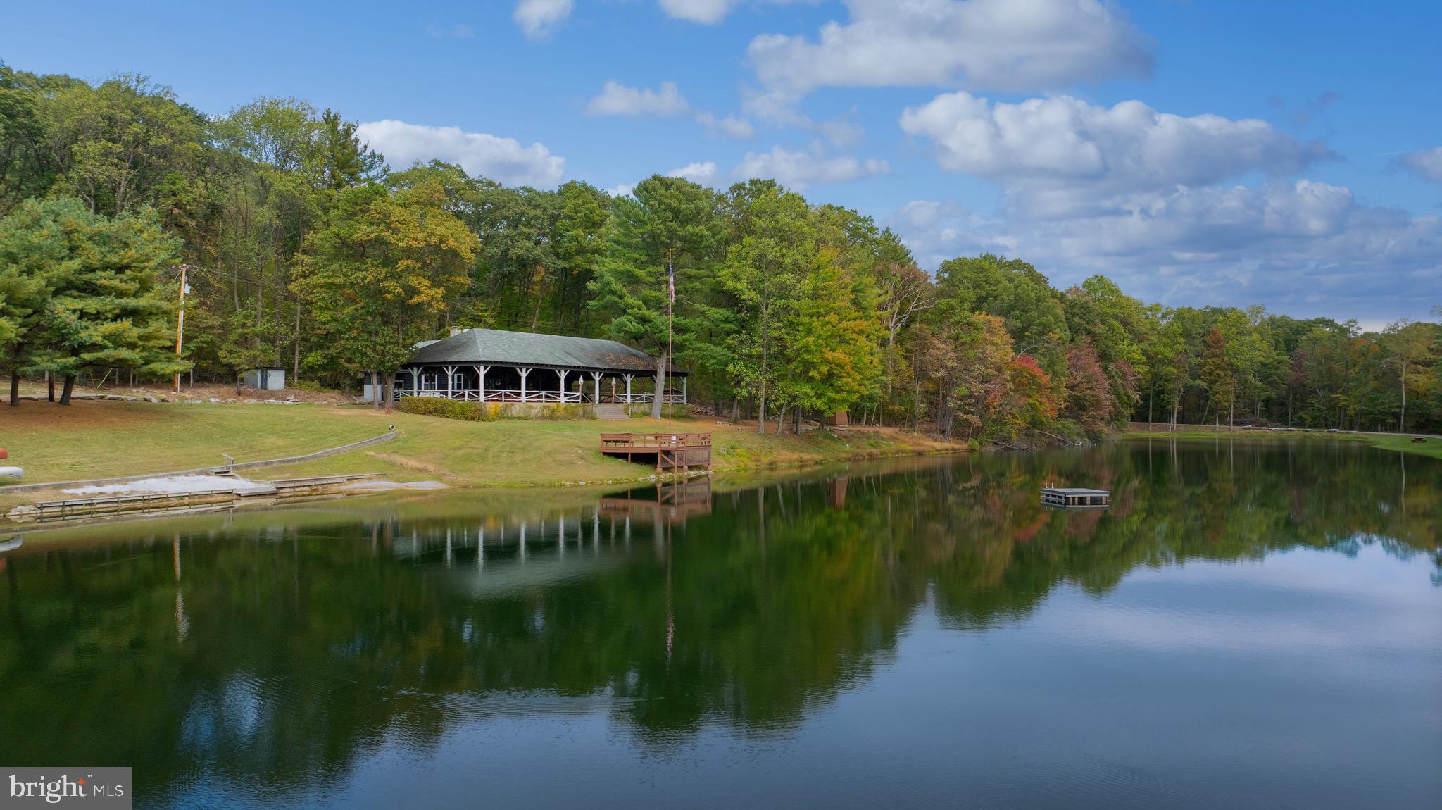 485 Airport Road Bethel, PA 19507 - Photo 55 of 71 a view of a lake with a house in the background