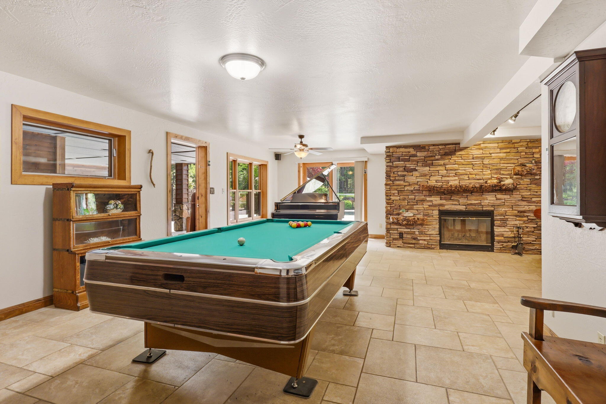 985 Elliott Creek Road Wilderville, OR 97543 - Photo 38 of 98 a room with pool table and windows