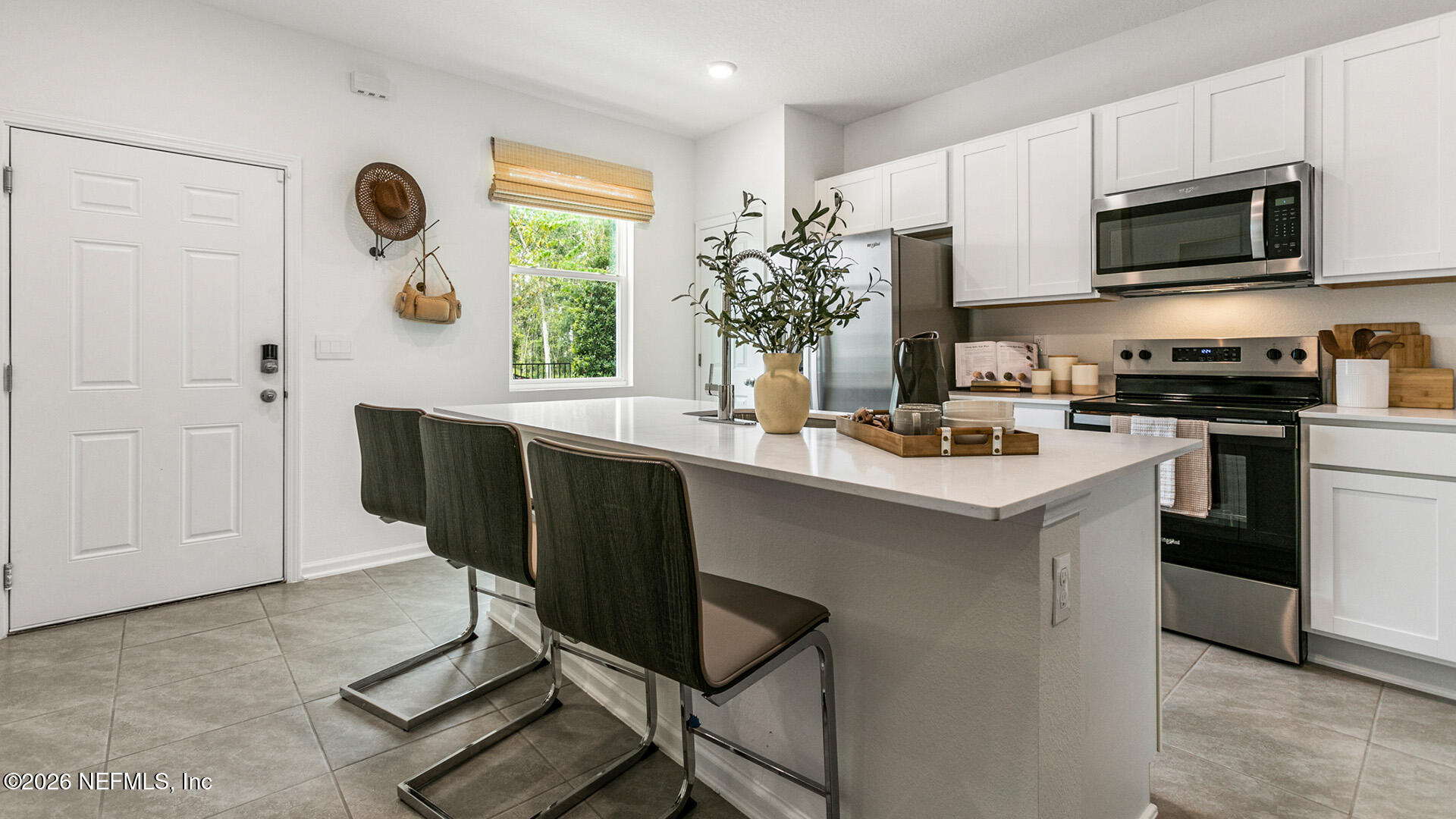 a kitchen with a sink cabinets and window