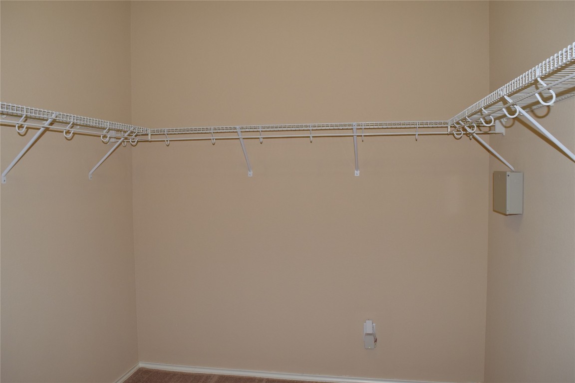 11717 Alexs Lane Austin, TX 78748 - Photo 14 of 32 a view of small space with racks on the wall