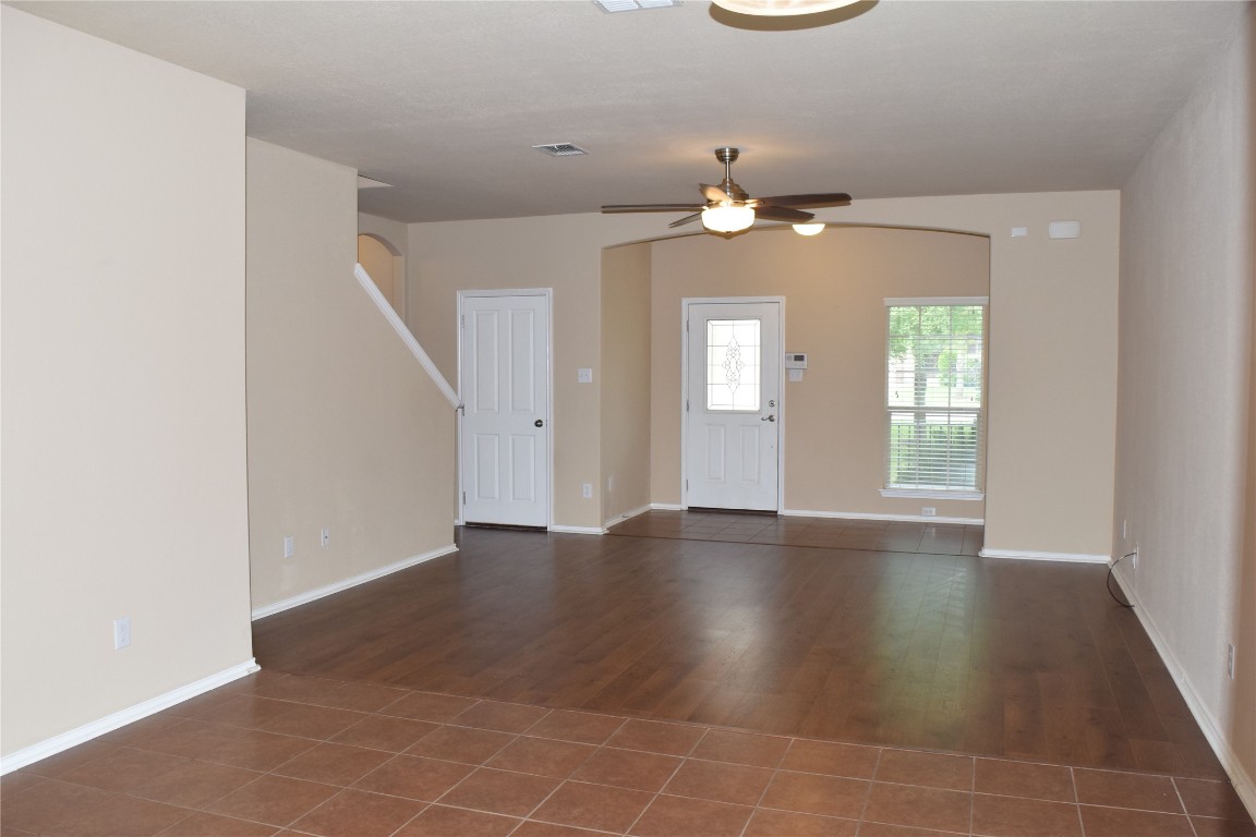 11717 Alexs Lane Austin, TX 78748 - Photo 18 of 32 an empty room with wooden floor and windows