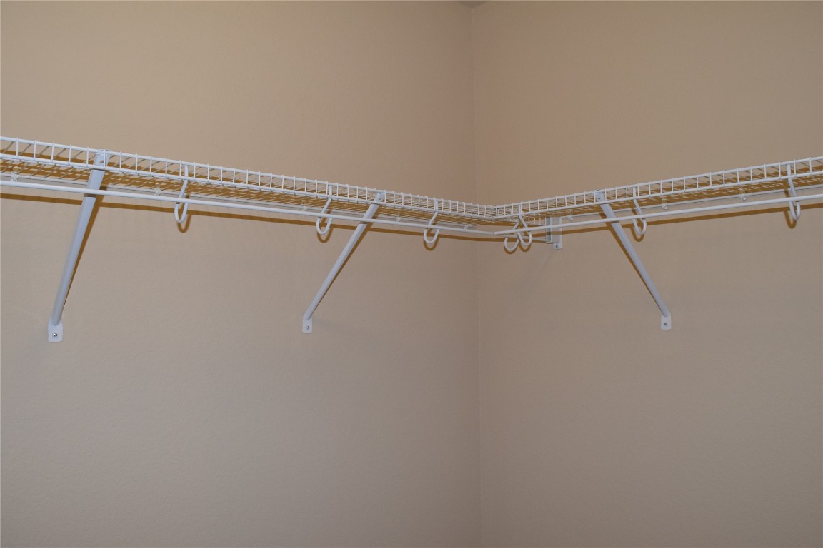 11717 Alexs Lane Austin, TX 78748 - Photo 27 of 32 a view of a room with racks on the wall