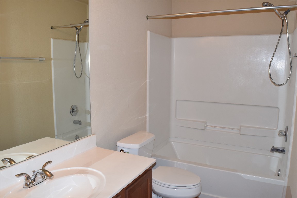 11717 Alexs Lane Austin, TX 78748 - Photo 31 of 32 a bathroom with a sink toilet and shower