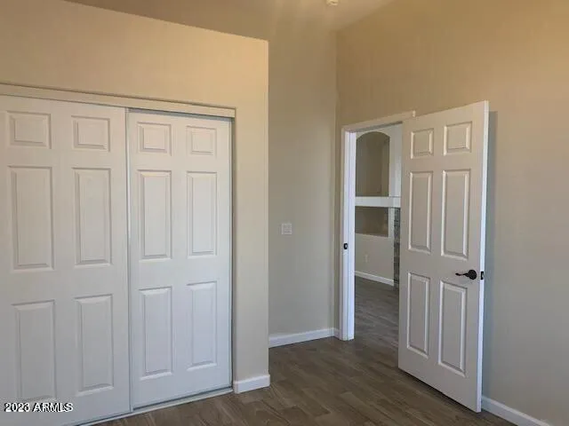 an empty room with wooden floor