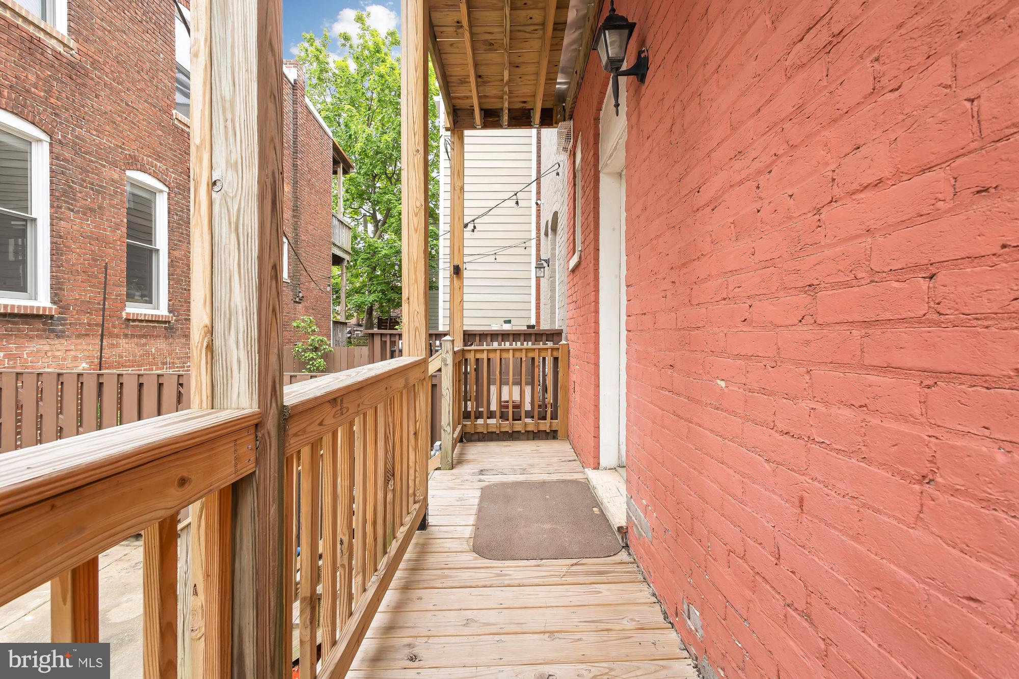 1819 1st Street Northwest, Unit A Washington, DC 20001 - Photo 13 of 38 a view of a porch with wooden floor and stairs