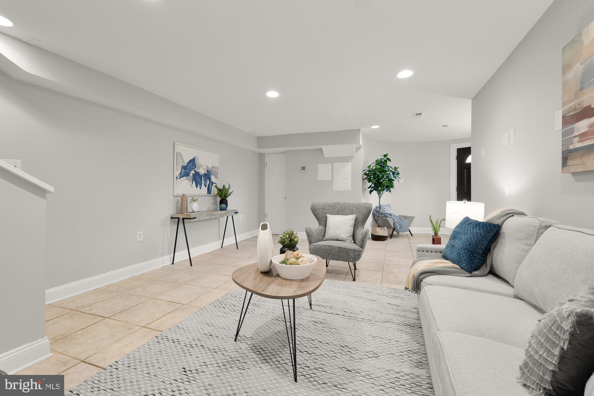 1819 1st Street Northwest, Unit A Washington, DC 20001 - Photo 15 of 38 a living room with furniture and a table