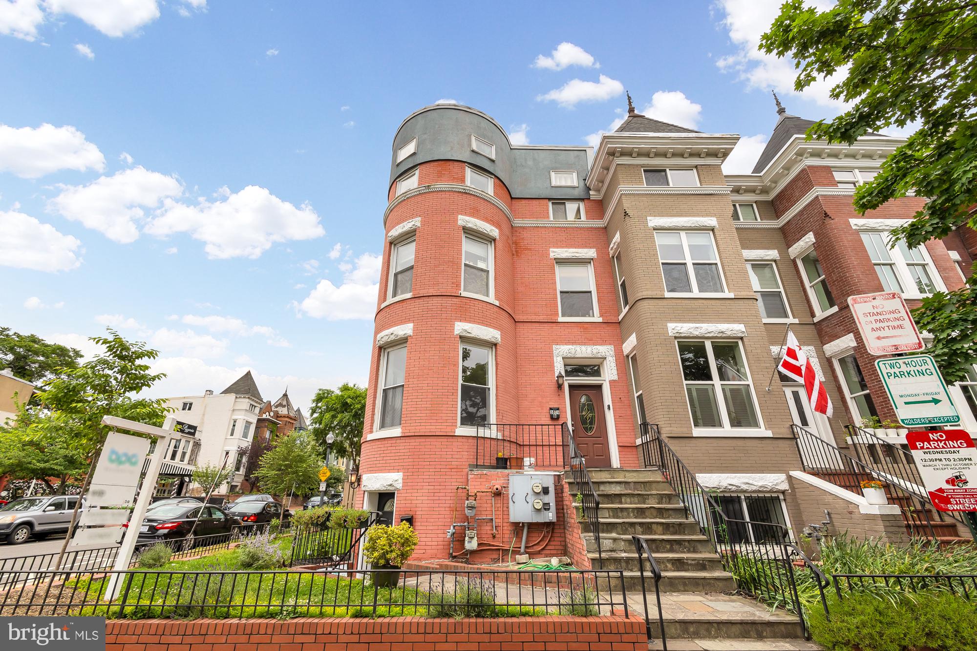 1819 1st Street Northwest, Unit A Washington, DC 20001 - Photo 2 of 38 a front view of a multi story residential apartment building with yard