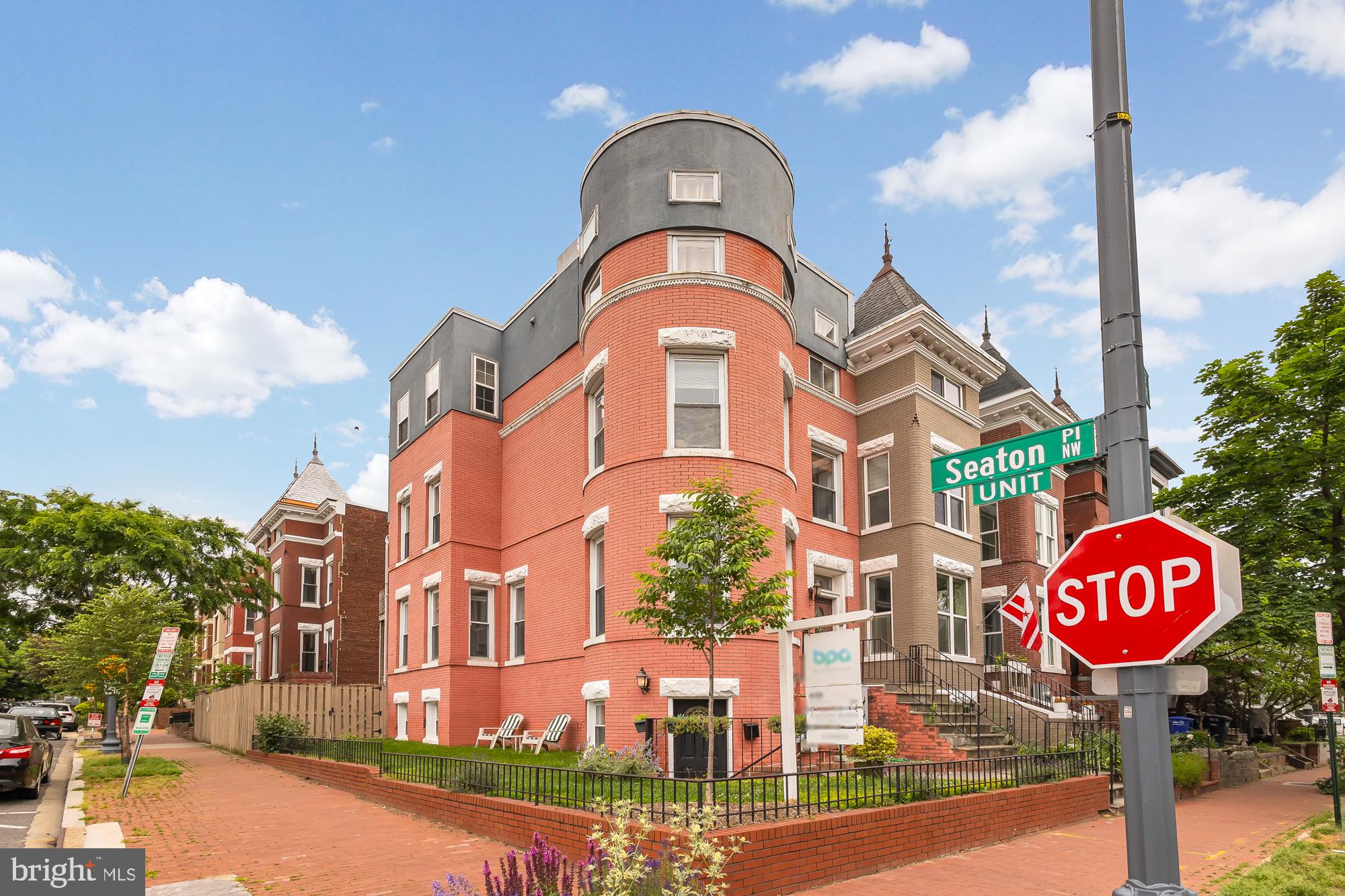 1819 1st Street Northwest, Unit A Washington, DC 20001 - Photo 3 of 38 a front view of a residential apartment building with a street sign