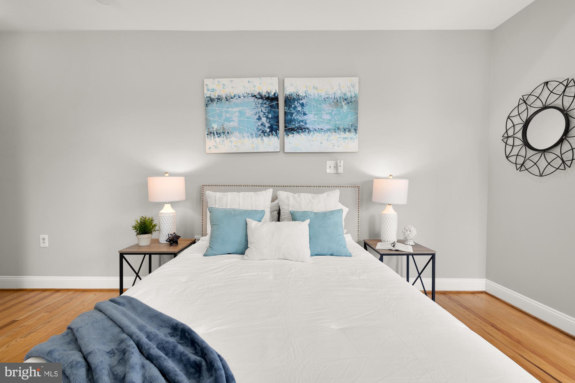 1819 1st Street Northwest, Unit A Washington, DC 20001 - Photo 31 of 38 a bedroom with a bed and a chandelier