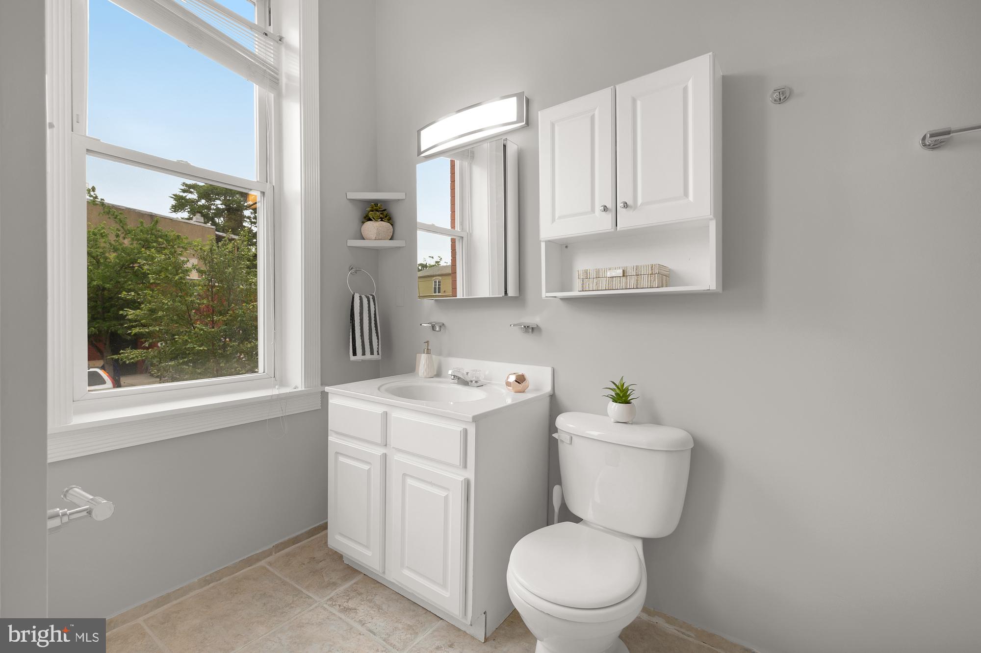 1819 1st Street Northwest, Unit A Washington, DC 20001 - Photo 34 of 38 a bathroom with a toilet sink and mirror
