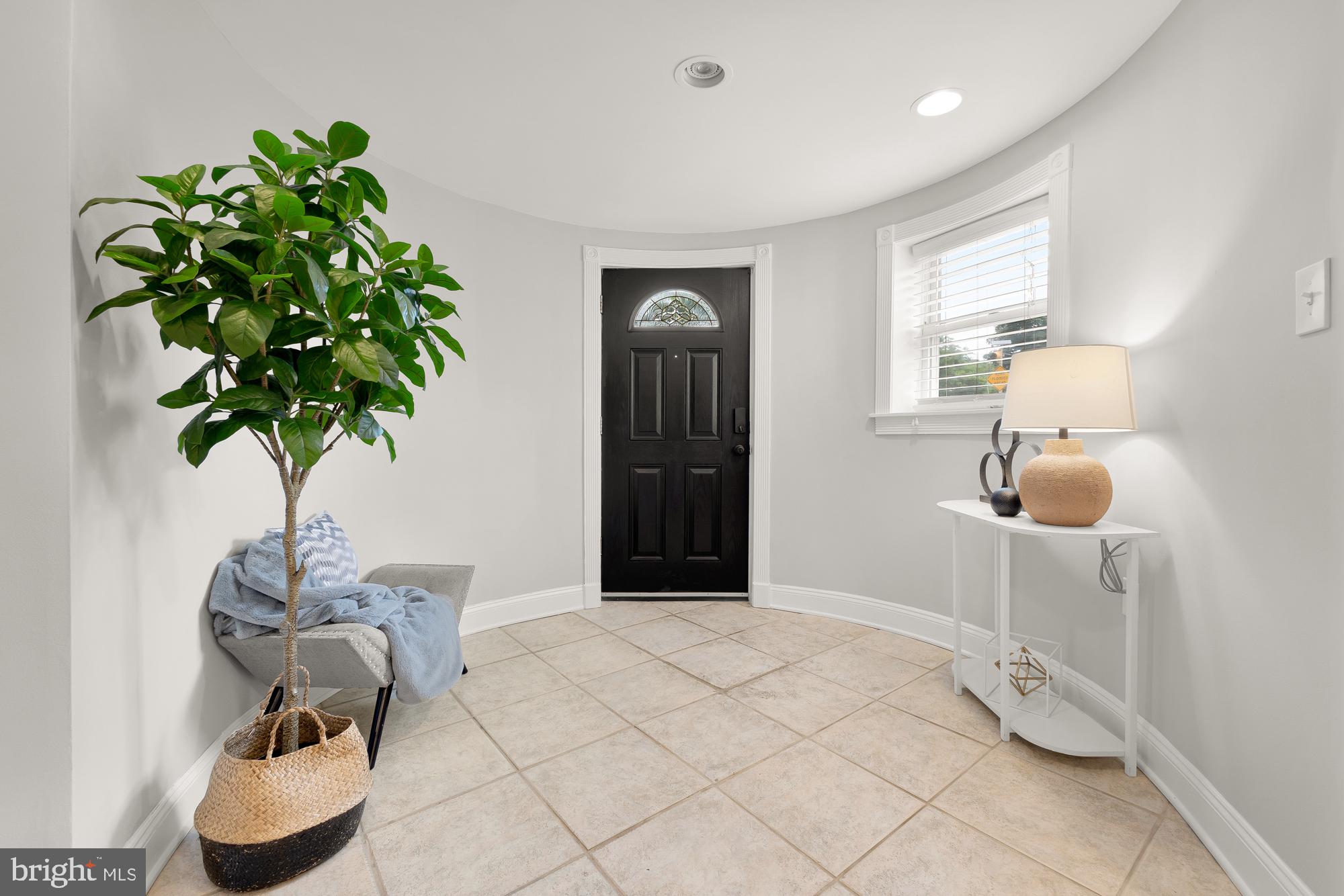 1819 1st Street Northwest, Unit A Washington, DC 20001 - Photo 4 of 38 a bedroom with a bed and a potted plant