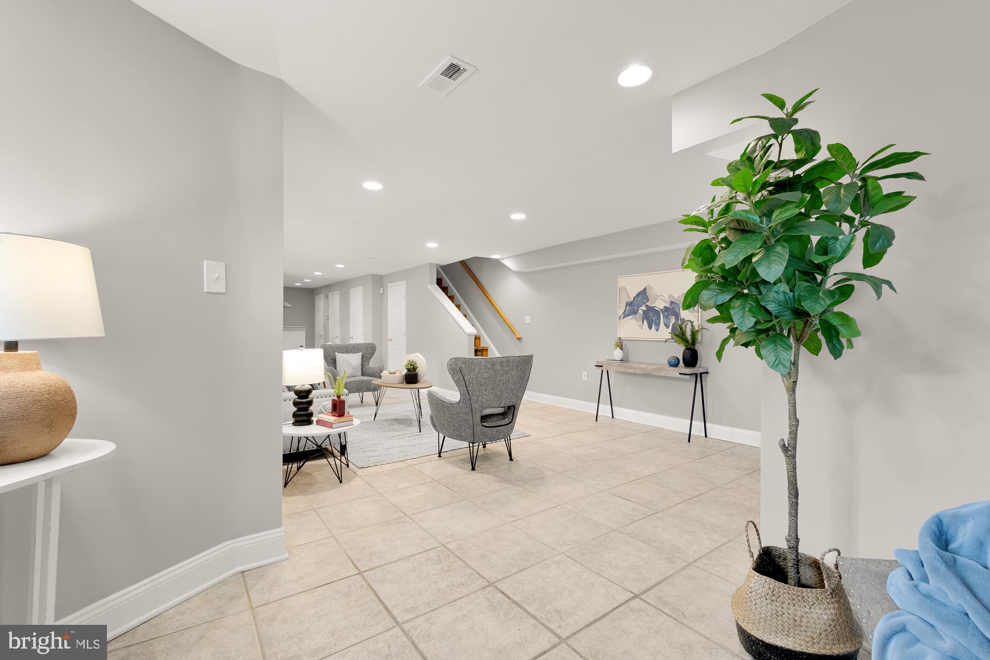 1819 1st Street Northwest, Unit A Washington, DC 20001 - Photo 5 of 38 a living room with furniture and a potted plant