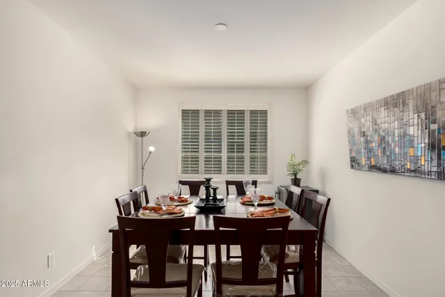 a view of a dining room with furniture and window