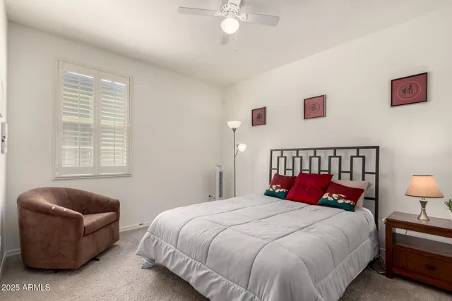 a bedroom with bed and window