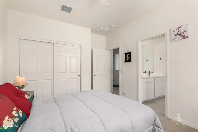 a bedroom with a bed and a closet