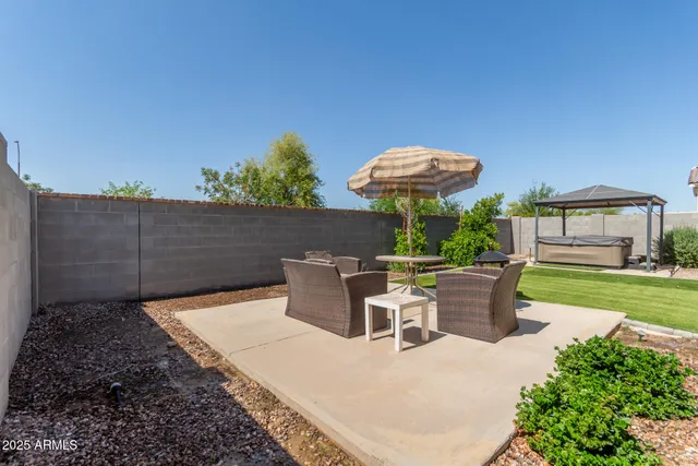 a view of backyard with outdoor seating