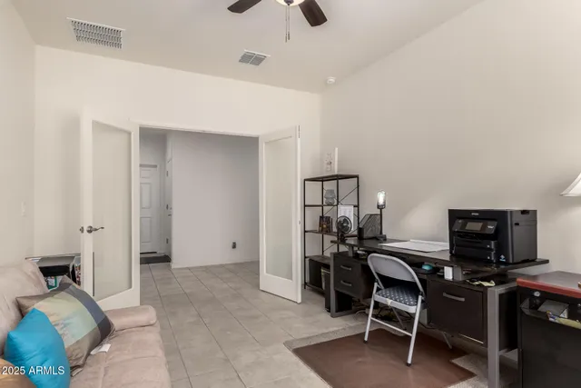 a view of a workspace with furniture