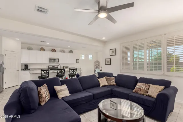 a living room with furniture and a large window