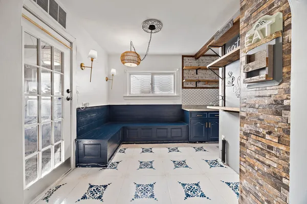 a bedroom with furniture and a window