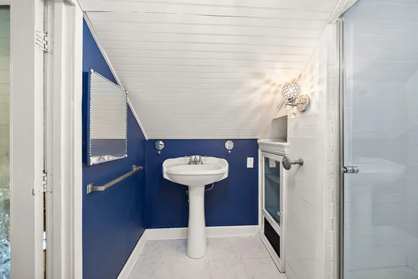 a view of a hallway with entryway dining table and chairs