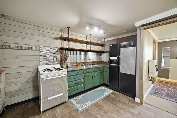 a kitchen with a refrigerator and cabinets