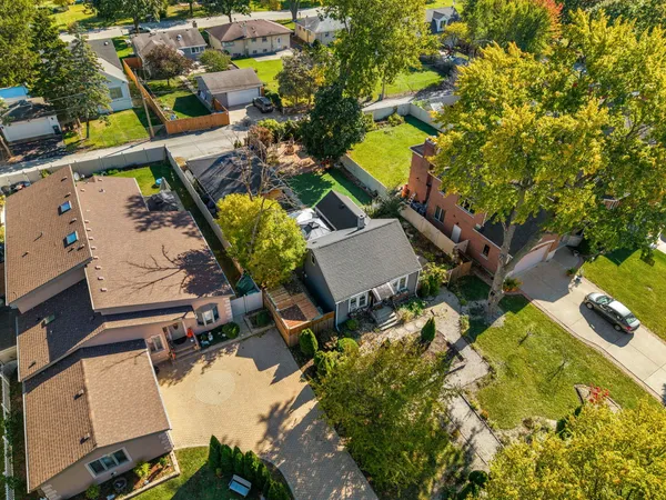 a kitchen with stainless steel appliances granite countertop a sink a stove and cabinets