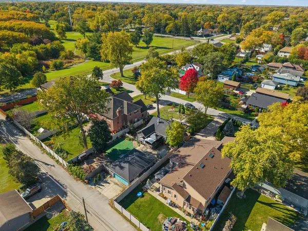 an aerial view of residential houses with outdoor space