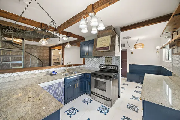 a kitchen with a stove and a refrigerator