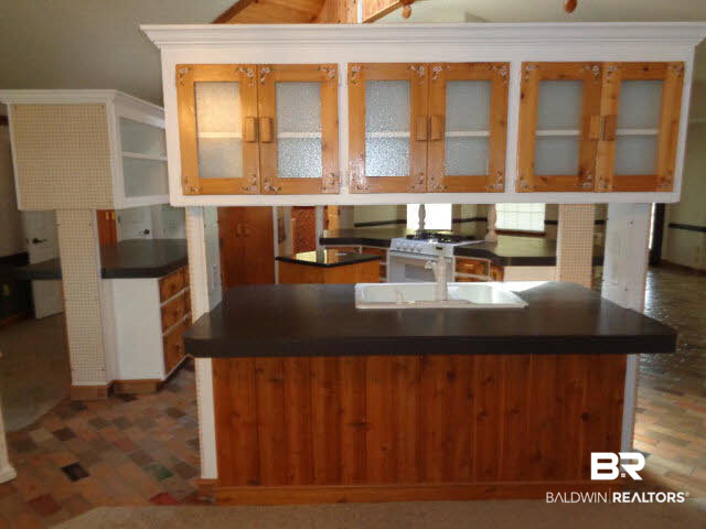 28202 Vargo Lane Elberta, AL 36530 - Photo 7 of 45 View from back door. Breakfast bar with cabinets above. There are 3 separate breakfast bars---in the dining room, living room and great room.
