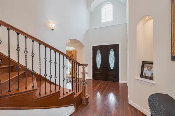a view of entryway with wooden floor
