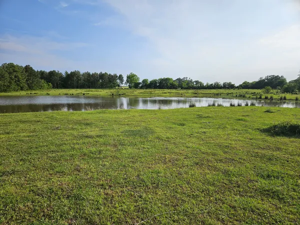 a view of a lake with houses in the back