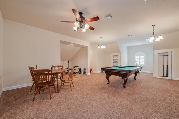 a room with furniture and a chandelier