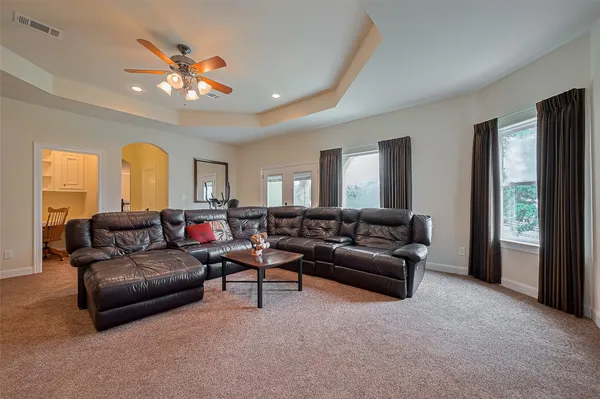 a living room with furniture and a large window